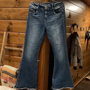 KanCan curvy denim flare jeans with 3 buttons and distressing.